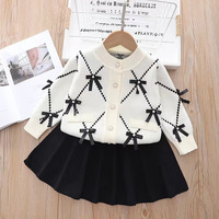 Ensemble de deux pièces en tricot pour filles, nouveau style, avec cardigan décoré d'un nœud pour les bébés filles