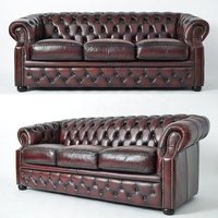 Canapé classique en cuir véritable, style Chesterfield antique, pour salon européen.