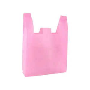 カスタムロゴ環境にやさしい再利用可能なダイカットハンドル食料品ショッピングTシャツバッグ不織布ハンドバッグ