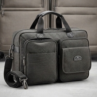 Sacoche pour ordinateur portable en tissu de coton gris foncé, style moderne, avec fermeture éclair, double poche frontale, poignée supérieure et bandoulière amovible