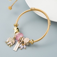 Bracelet en alliage doré incrusté de diamants, style bohème rétro ethnique européen et américain, avec éléphant, papillon et pierres précieuses