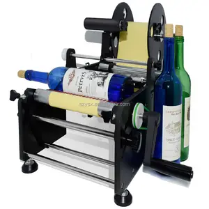 Máquina de etiquetado Manual de alta eficiencia para botellas redondas/máquina de etiquetado de pegatinas de botellas de 10mm para productos cilíndricos