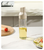 Distributeur d'huile en verre à bascule automatique anti-goutte, design tendance et pratique, pour la cuisine domestique et le stockage