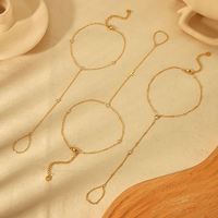 Bracelet de cheville bohème ethnique en alliage, style gitane, idéal pour les vacances à la plage, avec pompon et pièce de monnaie