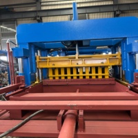 Machine à fabriquer des pavés en béton QT10-15 avec système d'alimentation automatique du matériau de face