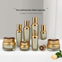 Flacons en acrylique pour cosmétiques, sérum, lotion, crème pour le visage, fond de teint, avec bouchon en plastique doré en forme de fleur, pot cylindrique en stock
