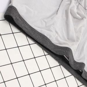 กางเกงบ็อกเซอร์ชายผ้าตาข่ายระบายอากาศดี สีพื้น ผ้าไหมน้ำแข็ง ขายส่ง - Product Image 4