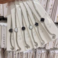 Nouveau bracelet à breloques en acier inoxydable TD avec plusieurs pendentifs cadran de montre, bracelet minimaliste pour femme à porter au quotidien