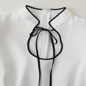 Abito Casual da donna bianco <span class=keywords><strong>con</strong></span> gonna corta Sexy a <span class=keywords><strong>manica</strong></span> lunga a mezzo collo alto <span class=keywords><strong>con</strong></span> decorazione a bottone cavo stile Streetwear intrecciato - Product Image 4