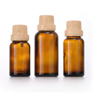 Botella de aceite esencial de vidrio ámbar cosmético con cubierta de madera de bambú falsa de China con tapa de Bambú - Product Image 2