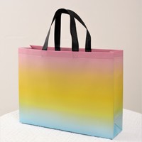 Sac fourre-tout non tissé laser coloré de bonne qualité avec impression de logo sac d'emballage de marque à la mode sacs-cadeaux de magasin