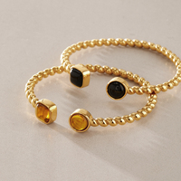 Bracelet manchette torsadé J&D Designer Vintage en acier inoxydable plaqué or 18 carats PVD avec ambre en résine naturelle
