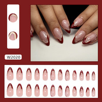 Ongles en amande rouges avec French manucure et contour doré, faux ongles à presser en ABS fabriqués à la machine, lot de 24 ongles en amande avec pointe dorée