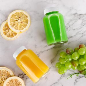 2oz Empty Round Pet Shot Plastic Bottles for Fresh Juice with Plastic <b>Tamper</b> Evident Lid 60ml Plastic Shot Bottles for Juice - Product Image 2