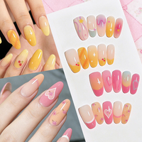 120 faux ongles à presser, boîte à 4 compartiments, forme amande moyenne, rose doux et jaune, motifs cerise, cœur et floral, pré-dessinés