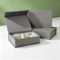 Boîte cadeau pliante élégante grise magnétique, boîte en papier pliable personnalisée avec logo et papier de remplissage pour l'emballage de produits de soin et de cosmétiques