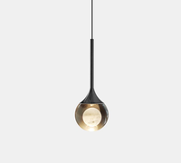Lustre suspendu moderne en cristal ovale à LED dimmable en noir/or pour chevet