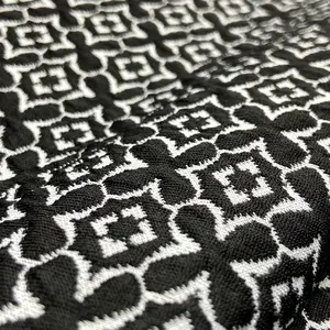 Fashionable polyester stretch 270gsm knit black jacquard fabric with four leaf clover pattern for jacket