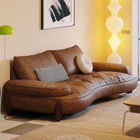 Canapé modulable en cuir Cognac Dune Cloud avec ottoman, pieds en bois capitonnés, accoudoirs rembourrés, mobilier de salon