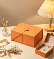 Boîte cadeau écologique à double porte personnalisée QingChuan, emballage de luxe pliable magnétique, gravure laser, boîte rigide orange pour cosmétiques