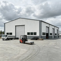 Entrepôt en acier préfabriqué de haute qualité et durable avec porte à enroulement et niveleur de quai – Bâtiments industriels