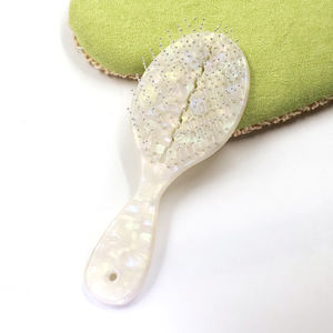 MD Factory, venta al por mayor, logotipo personalizado, cerdas suaves, masaje, desenredar, ventilación, cojín de aire natural, acetato + cepillo de pelo de nailon - Product Image 1