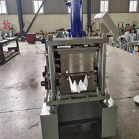 Gouttières rondes de petit prix usine faisant former la machine portative de tuyau de descente de gouttière et de rouleau de coude de pluie