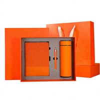 Coffret cadeau d'affaires en cuir personnalisable de luxe, comprenant un carnet A5, un stylo et une tasse isotherme.