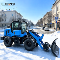 Chargeuse frontale compacte avec lame à neige, pousse-neige robuste pour le déneigement des parkings