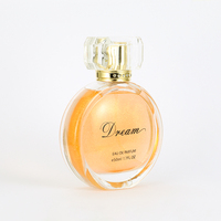 Parfum pour femme en verre, liquide orange cristallin, capuchon à facettes, vaporisateur doré, motif, boîte marron, rêveur, longue tenue