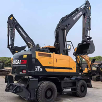 Excavatrice sur pneus Hyundai R210W-9 d'occasion 100% coréenne, 21 tonnes, avec moteur Cummins, pompe et PLC, modèle 2023, équipement pour travaux de terrassement