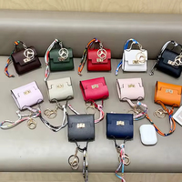 Nouveau porte-clés en cuir PU avec porte-monnaie, sac de promenade pour animaux, étui à rouge à lèvres, support pour écouteurs, porte-clés de voiture, pochette à friandises pour chiens et chats