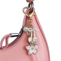 Porte-clés en métal pour femme, motif fleurs colorées et nœuds, avec perles et papillons, tendance et personnalisé, vente en gros