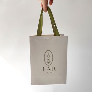 Sac de shopping en papier blanc écologique de luxe KM avec logo imprimé personnalisable pour la promotion et l'emballage de bijoux/vêtements Cadeau - Product Image 1