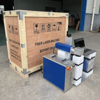 Machine de marquage laser à fibre 10W pour l'élimination de la peinture sur les boutons transparents en plastique