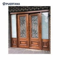 Porte d'entrée en bois massif sur mesure avec grille décorative en fer forgé et design en fonte pour l'extérieur
