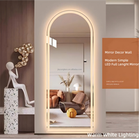 Miroir intelligent mural en verre cintré avec LED et interrupteur tactile pour salle de bain