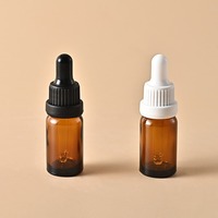 Bouteille en verre Transparent épaissie brune résistante à la lumière embout en plastique estampé à chaud compte-gouttes pour huile essentielle goutte pour les yeux