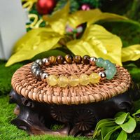 Bracelet unisexe tendance fait main en perles de 8 mm en cristal vert naturel, œil de Dong Shi jaune et minerai de fer rouge