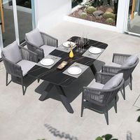 Ensemble table et chaises d'extérieur en aluminium au design nordique, résistant à l'eau et aux UV, chaises longues en rotin pour patios, villas, hôtels