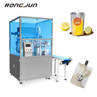 Machine de remplissage et de capsulage de poche à bec liquide rotatif de bureau électrique pour l'emballage de boisson à la gelée de jus dans des sachets à bec