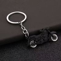 Porte-clés mousqueton moto de simulation cool en alliage de zinc, design roue rotative, résistant aux UV et à l'eau, pendentif de sac automobile, nouveauté, vente en gros