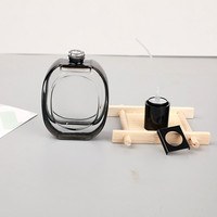 Botella de Perfume de Vidrio Ovalada de 30 ml con Borde Negro y Tapas Negras, Personalizable con la Etiqueta de su Marca