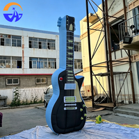 Guitare gonflable publicitaire personnalisée en tissu Oxford avec ventilateur intégré pour la décoration de scène de festival de musique