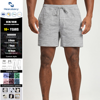 Shorts de sport pour homme à taille élastique en tricot uni avec poche zippée discrète - Shorts actifs extensibles et doux pour les squats et l'entraînement