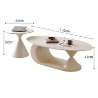 Table basse ovale de luxe moderne en pierre frittée pour petit appartement, salon, avec rangement et design durable