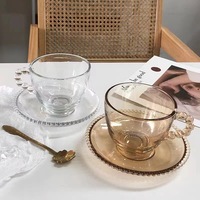 Tasse en verre transparent épaissi de haute qualité tasse en verre de lait résistant à la chaleur conception de perles tasse à café domestique avec poignée