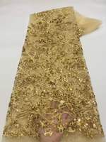 Tissu en dentelle jaune brodé de perles et de paillettes pour robes de soirée et vêtements de fête - Matière élégante et luxueuse pour robes