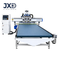 Routeur CNC à quatre broches pour le découpage, le perçage et la fabrication de meubles en panneaux de bois, avec chargement et déchargement automatiques