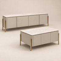 Ensemble de meuble TV et table basse WYRAX en deux pièces avec dessus aspect marbre blanc, coins arrondis, pieds dorés et rangement